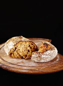 Sourdough bread with pieces of apple and raisins