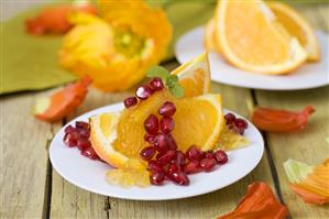 Orange wedges with pomegranate seeds and orange jelly