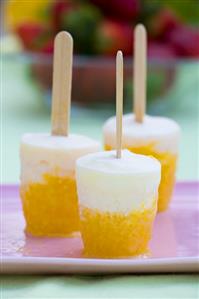 Home-made yoghurt and peach ice lollies