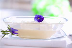 Polish milk soup garnished with beaten egg white & flowers