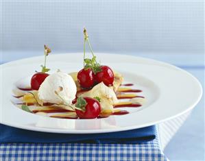 Lemon crêpe with cherries and sour cream ice cream