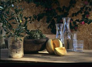 Olive branches, Cavaillon melon, artichokes and carafes