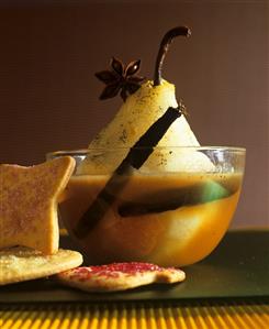 Poached pear with spices and biscuits