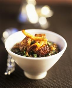 Bouillon with fried duck and herbs