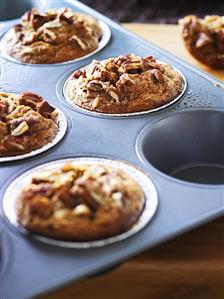 Wholemeal banana muffins in a muffin tin