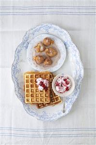 Cinnamon waffles with cranberry cream, Schlosserbuben (prune fritters)