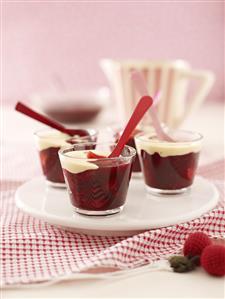 Red fruit compote and custard in glasses