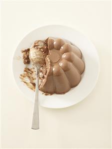 Chocolate blancmange with spoon