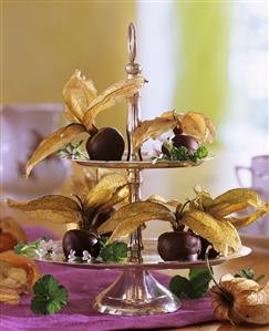 Chocolate-dipped physalis on tiered stand