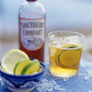 Drink made with Southern Comfort, lime and lemon slices