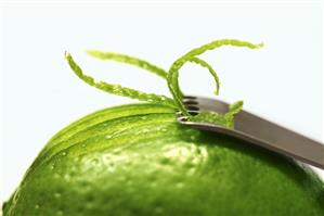 Zesting a lime with a zester (close-up)