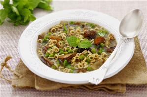 Mushroom soup with peas and noodles