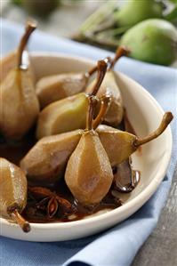 Whole pears with chocolate sauce