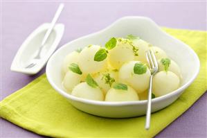 Melon balls with mint and lime zest