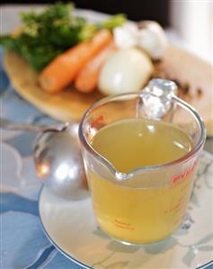 Vegetable stock in a measuring jug