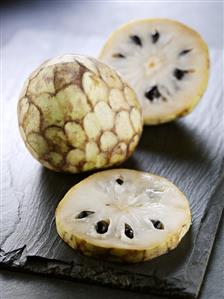 Cherimoya, whole and sliced