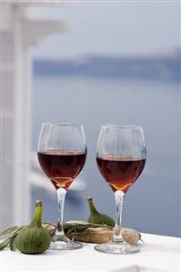 Red wine with fresh figs and olive branch