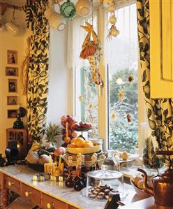 Christmas display with biscuits and fruit by window