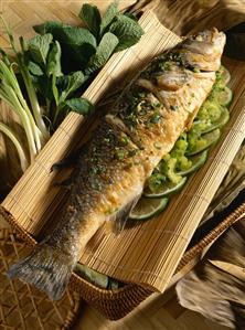 Bass with herbs and lime slices (Vietnam)