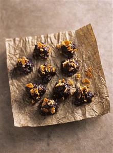 Chocolate plum sweets with almond brittle
