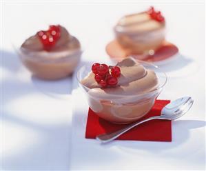 Chocolate dessert garnished with redcurrants