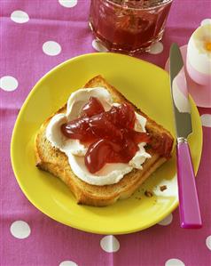 Slice of toast with soft cheese & blackberry & grapefruit jelly