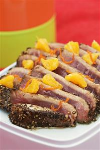 Fried tuna in pepper crust with orange sauce