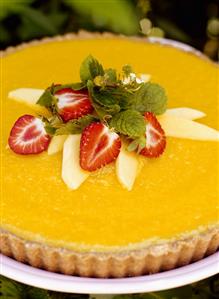 Mango tart with fresh strawberries