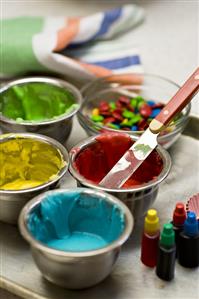 Coloured icing and chocolate beans for decorating cakes