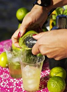 Squeezing a lime for a cocktail