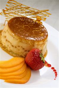 Crème caramel with peaches and caramel lattice