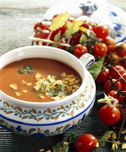 Tomato soup with tortilla chips in a soup tureen