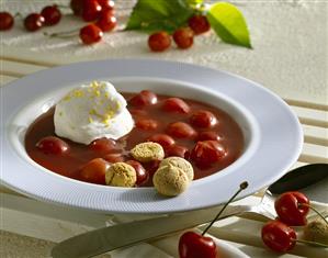 Cold sour cherry soup with whipped cream and amarettini