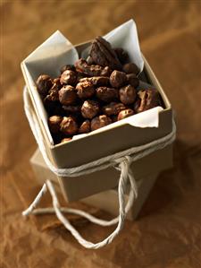 Chocolate-coated nuts