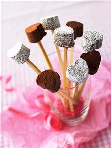 Heart-shaped chocolates on sticks