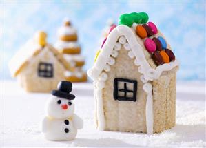 Gingerbread house with chocolate beans and snowman