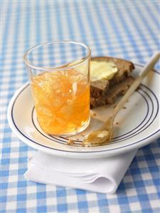 Apple jelly with flaked almonds, bread and butter