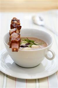 Bean soup with cured pork skewer