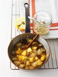 Apple and pear compote in a pan