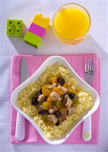 Pork with plums and apricots on couscous