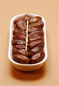 Dried dates with plastic fork