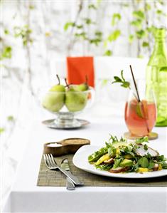 Salad leaves with avocados, pears, grapefruit drink