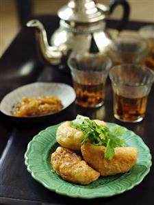 Apple fritters with apricot jam and tea