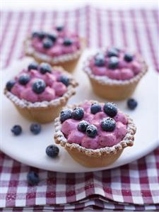 Four blueberry tarts