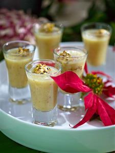 Mixture of leeks, cheese and pistachios in shot glasses