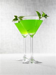 Two Melon Martinis with mint leaves