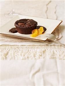 Warm chocolate ricotta pudding with mandarin orange segments