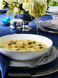 Shellfish soup and glass of white wine (Christmas)