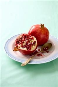 Pomegranates, whole and a half