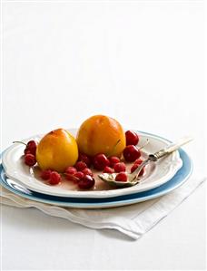 Poached peaches with raspberries and cherries